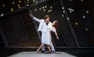 Tony and Stephanie dance in their competition wearing the iconic white apparel.