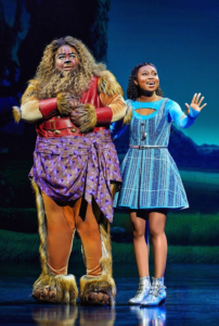 Lion and Dorothy consider seeing the Wiz together.